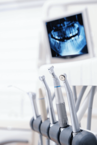 dental tools in front of x-ray