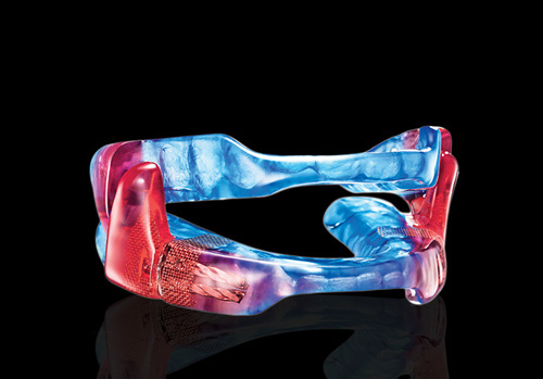 photo of blue and red sleep appliance mouth guard